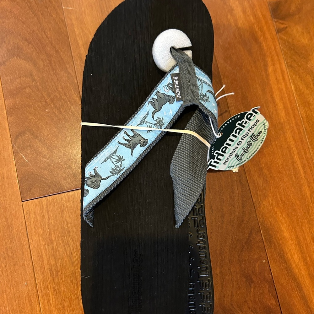 Tidewater "By The Shore" flip-flops with a contoured footbed and arch support. 